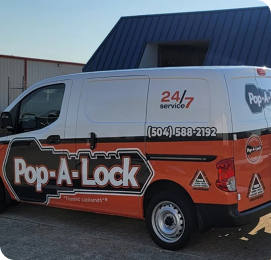 Pop-A-Lock Baton Rouge service van in a parking lot.
