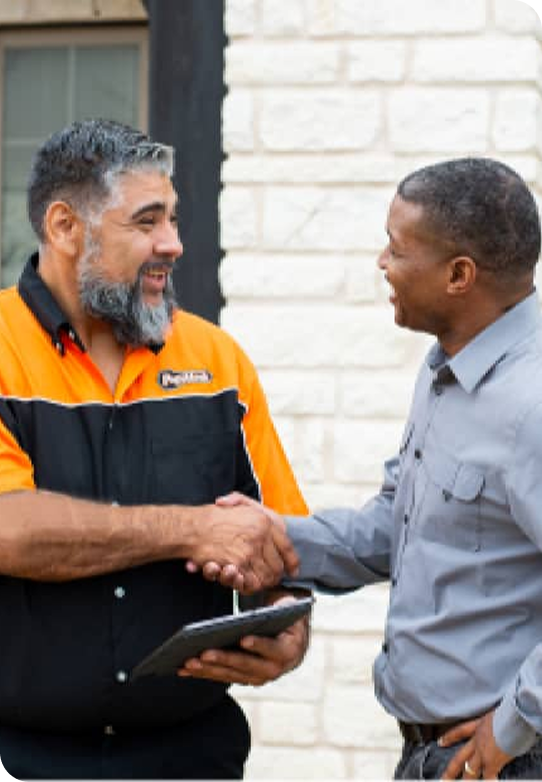 locksmith shaking hands with a customer after providing a service