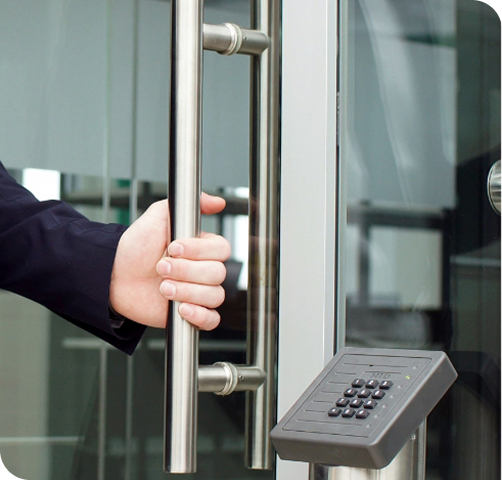 Commercial locksmith installing keypad door lock