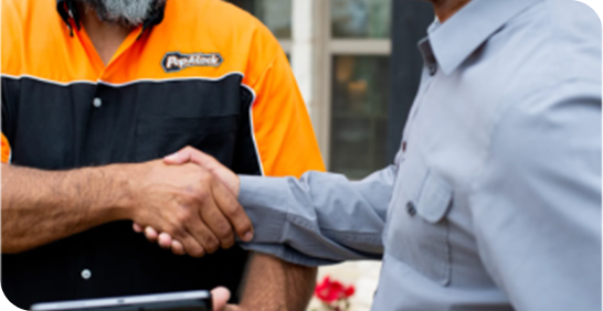 Pop-A-Lock Baton Rouge technician shakes hands with customer.