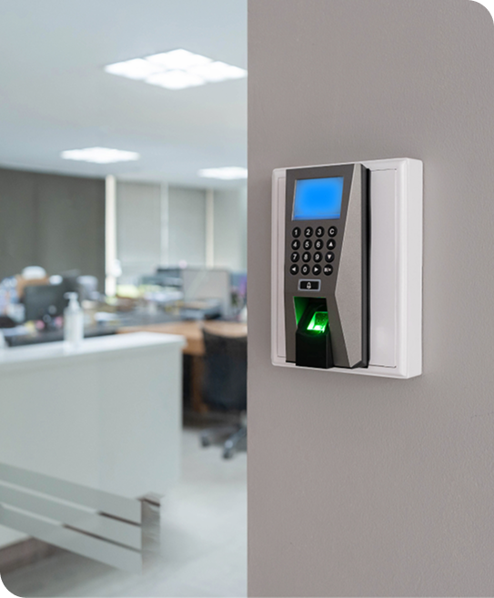 Commercial locksmith installing biometric door access