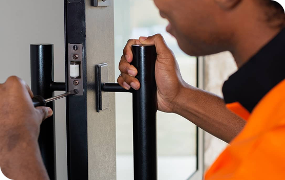 Professional locksmith fixing residential door lock